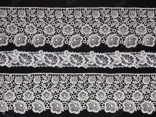 White lace on black background