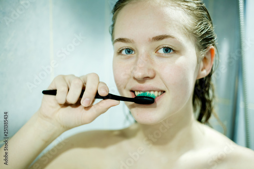 a young girl and a toothbrush