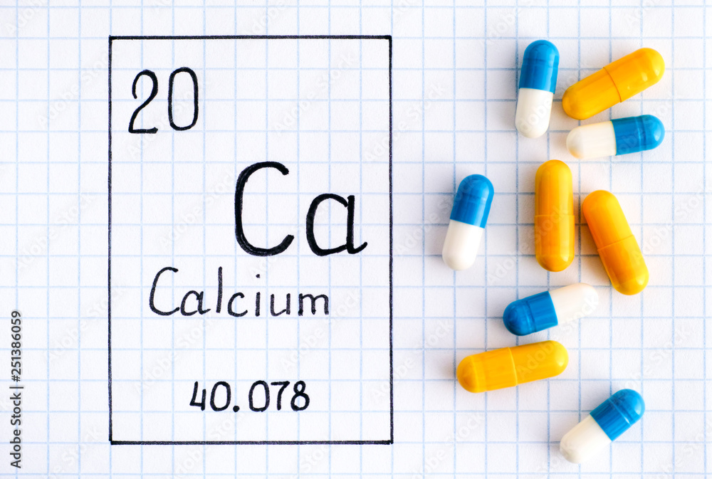 Handwriting chemical element Calcium Ca with pills. Handwriting chemical element Calcium Ca with pills.