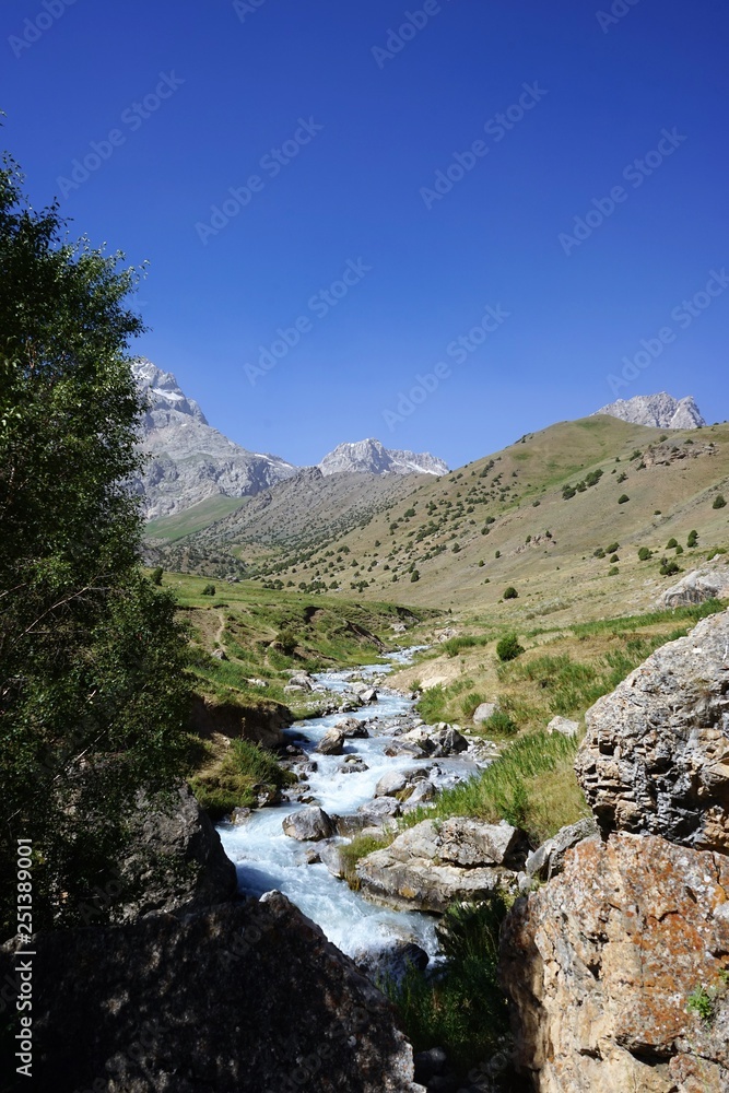 Rocky river in the mountain valley, Fann Mountains, Tajikistan Rocky river in the mountain valley, Fann Mountains, Tajikistan