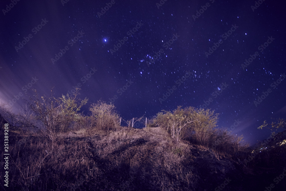 Fototapeta premium starry sky seen from the perspective of a small town in Latin America