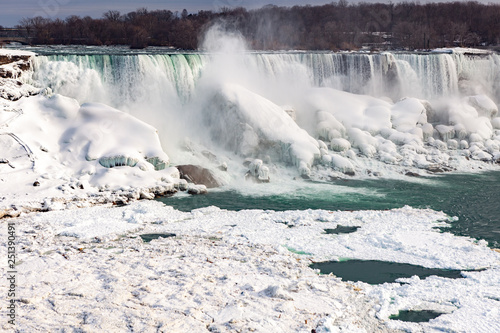 Wallpaper Mural Niagara Falls CANADA - February 23, 2019: Winter frozen view at the American side of beautiful Niagara Falls cower with snow and ice Torontodigital.ca