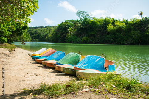 Pedal boats at Lagoa Azul, beautiful lagoon surrounded by preserved Atlantic Forest on Itamaraca island, Brazil