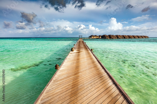 Wooden jetty on the ocean on Maldives Islands. © Photocreo Bednarek