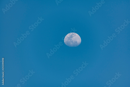 the moon in blue sky