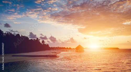 Sun setting on a tropical island.