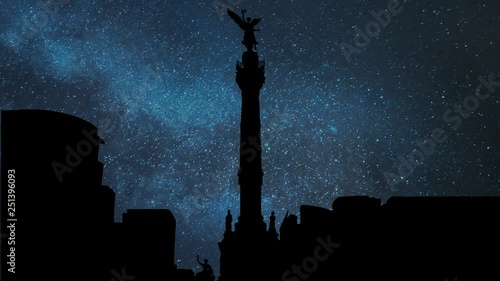 The Angel of Independence ( Monumento a la Independencia ) and Skyline of Mexico City by Night with Stars, is a Victory Column on Paseo de la Reforma, Worlwide Known Symbol of the Capital photo