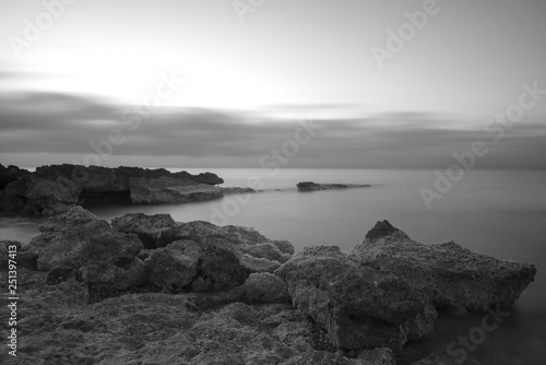A sunrise by the sea in black and white