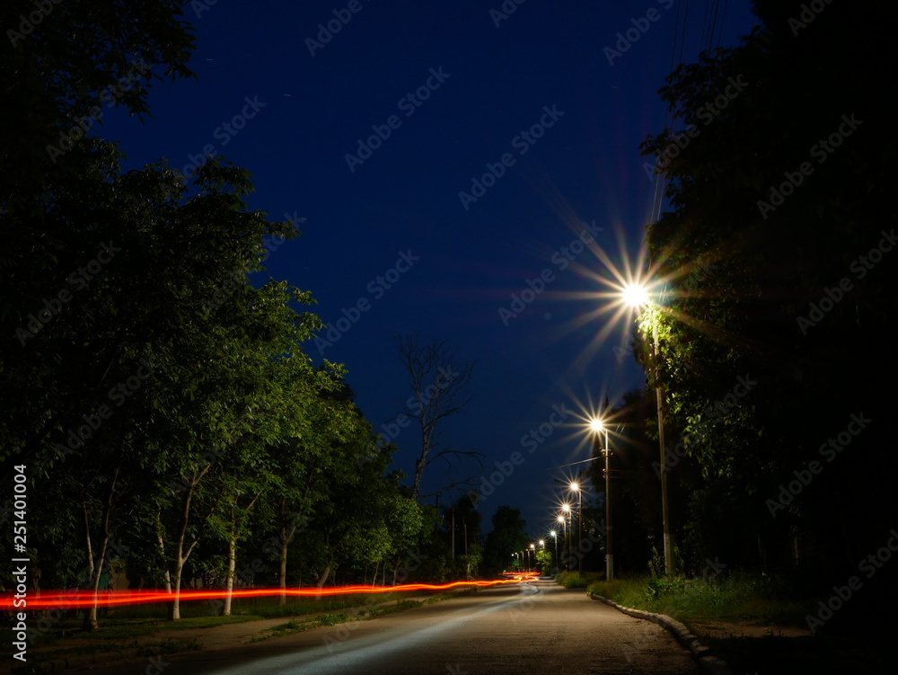 Polonne / Ukraine - 22 May 2018: street lights with light from cars at night