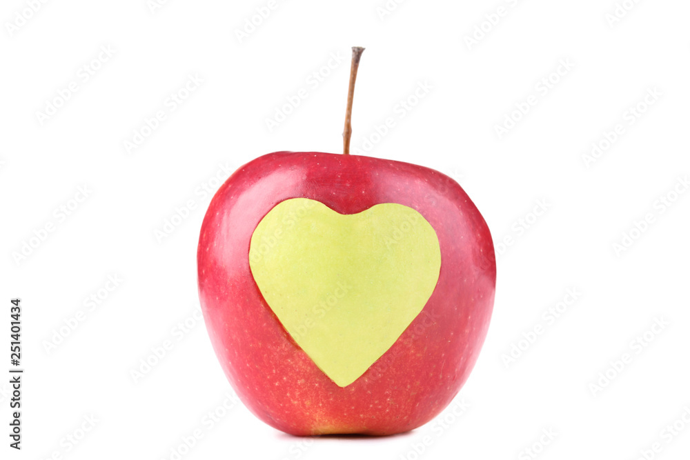 Obraz premium Red apple with cutout heart shape on white background
