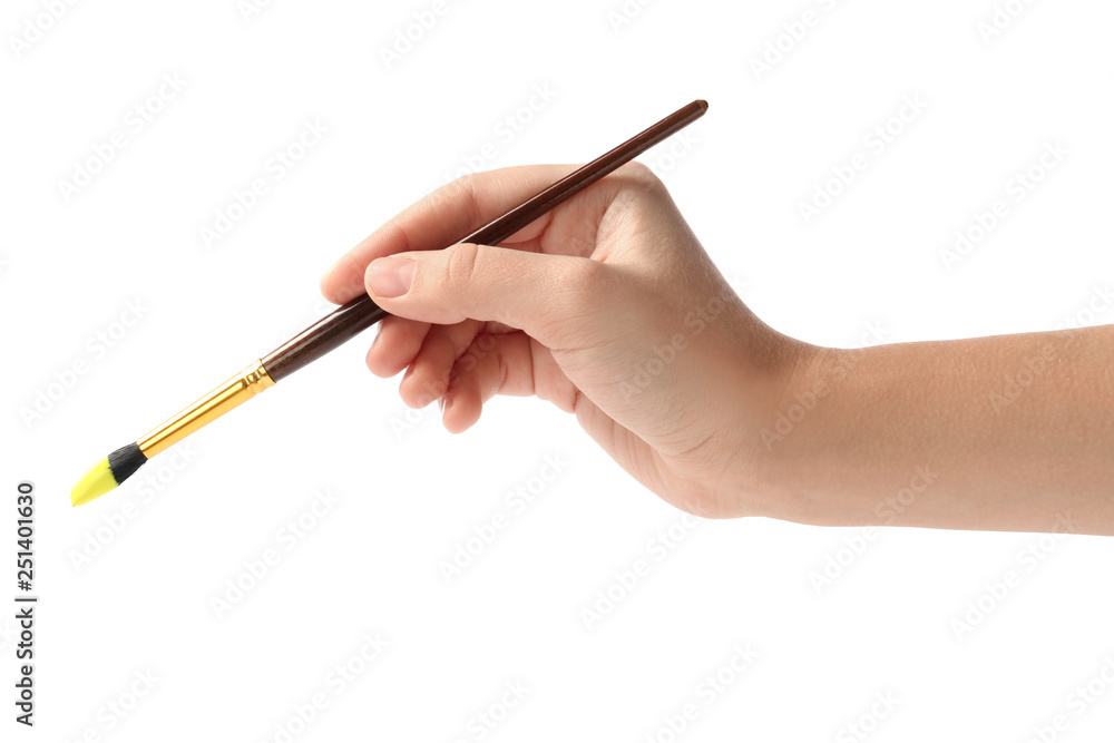 Young woman holding brush with color paint on white background, closeup Young woman holding brush with color paint on white background, closeup