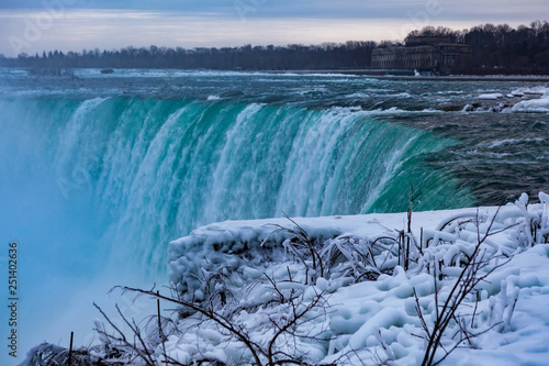 Niagara Falls CANADA - February 23, 2019: Winter frozen idyll at Horseshoe Falls, the Canadian side of Niagara Falls, view showing as well as the upper Niagara River