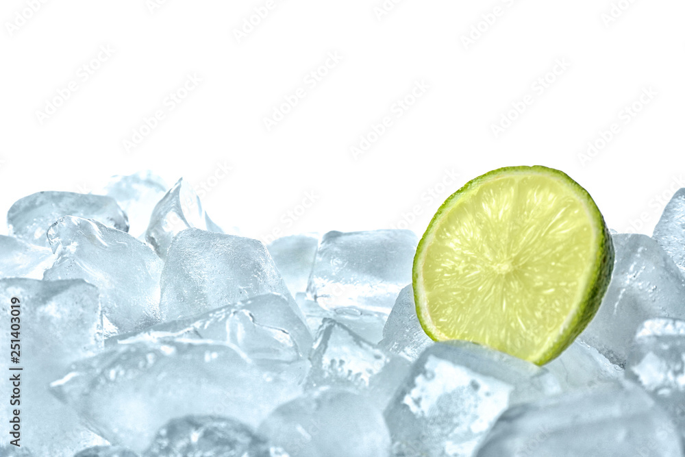 Fresh lime on ice cubes against white background Fresh lime on ice cubes against white background