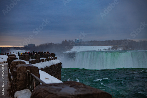 Niagara Falls CANADA - February 23, 2019: Winter frozen idyll at Horseshoe Falls, the Canadian side of Niagara Falls, view showing as well as the upper Niagara River photo