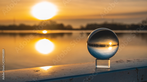 Crystal ball sunset shot with reflections at Plattling-Isar-Bavaria-Germany