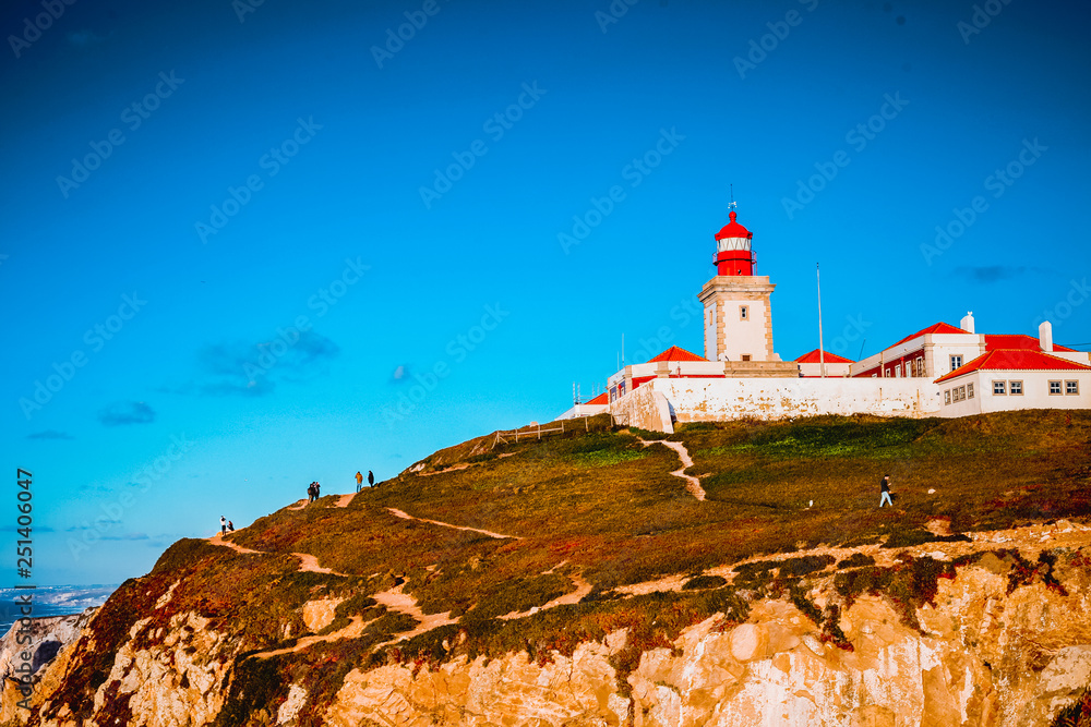 Picturesque view of Cabo da Roca Lighthouse on hill at sunny day, Portugal