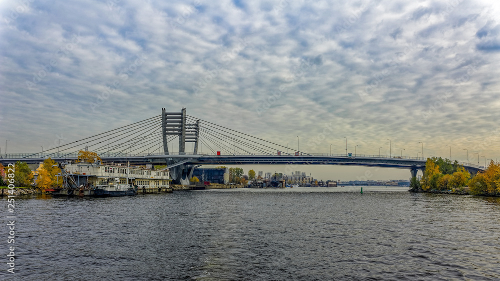 Fototapeta premium Central part of new Bettencourt bridge across the river Malaya (Small) Neva in Saint-Petersburg, Russia at autumn.