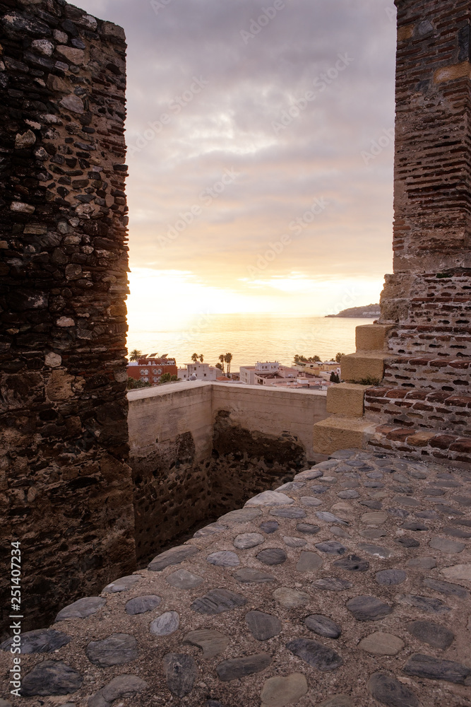 sunset looking out over the city of almunecar spain