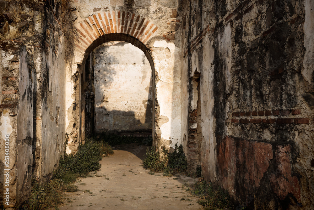 Sun lightened arch in ruins of Templo de San Jose cathedral, Antigua, Guatemala, Central America