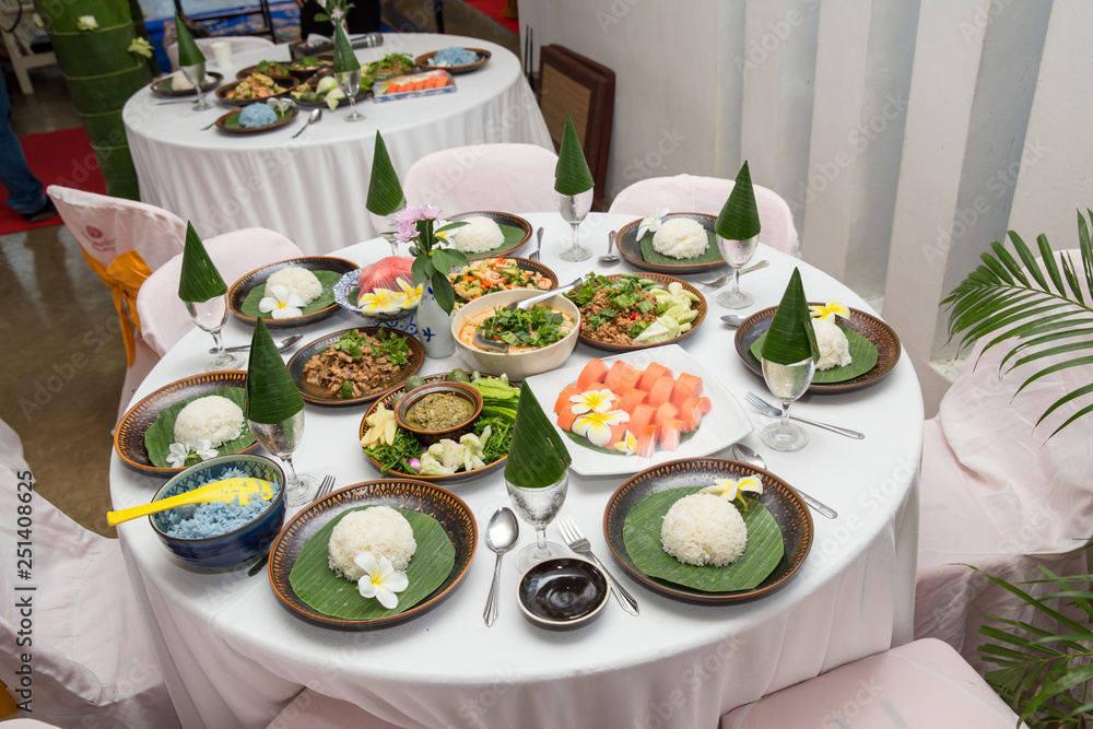 Tradition Northern Thai food. on a wooden table, Set of Thai food popular  menu. radition lunch or dinner.Thai food concept Spicy Paste Dip Nam Prik  Asian style banquet.Thai traditional Kantoke set. Photos