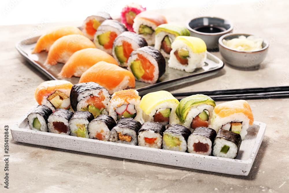 close up of sashimi sushi set with chopsticks and soy - sushi roll with salmon and sushi roll with smoked eel close up of sashimi sushi set with chopsticks and soy - sushi roll with salmon and sushi roll with smoked eel