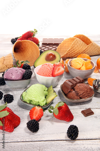 Set of ice cream scoops of different colors and flavours with berries  chocolate and fruits.