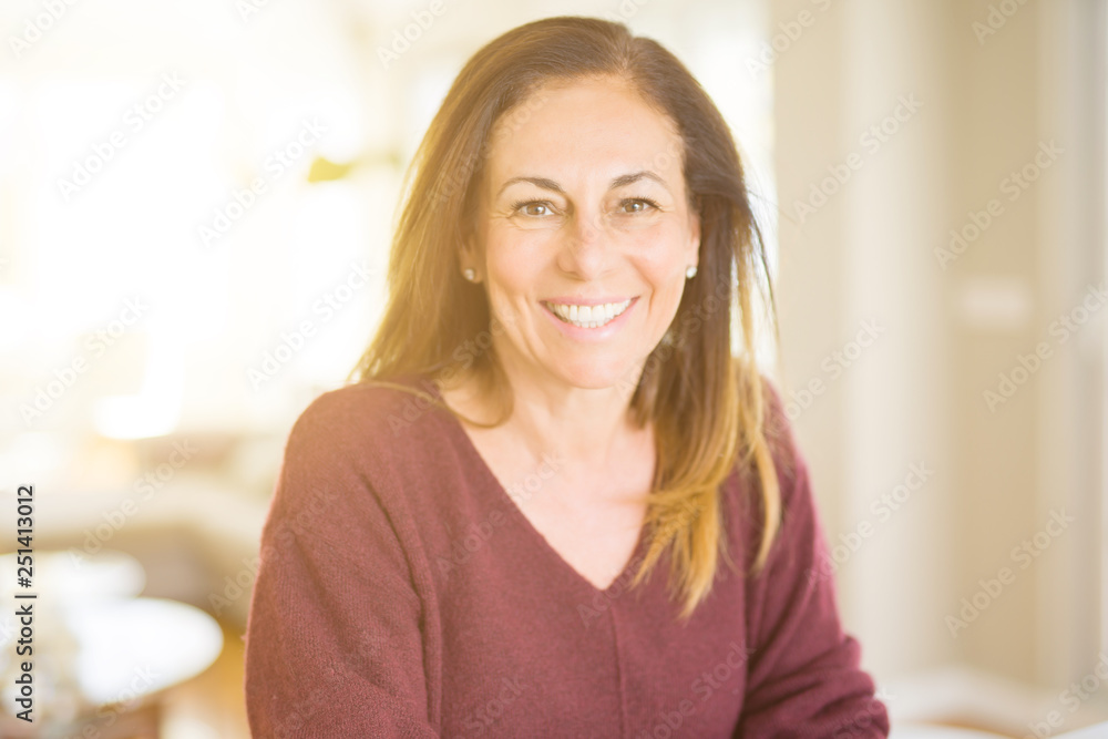Beautiful middle age woman smiling at home Beautiful middle age woman smiling at home