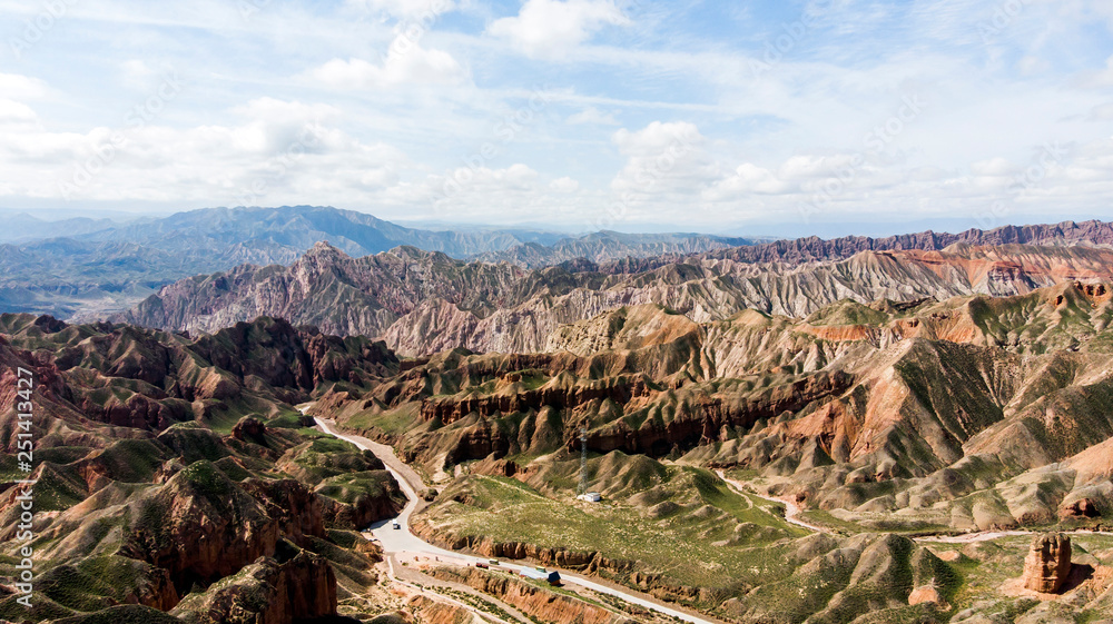Binggou Danxia Canyon Landform. Road Valley in the Geopark.