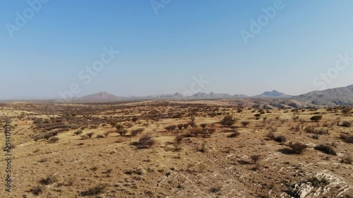 Arid desert landscape of Central Khomas Highland with very steep Gamsberg and Spreetshoogte Pass in Namibia, Aerial drone shot photo