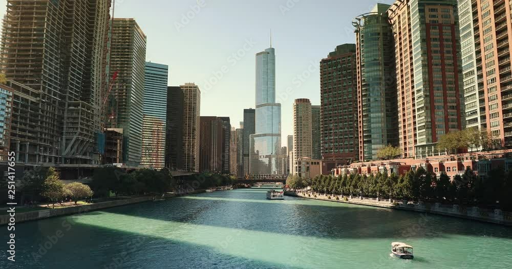 City buildings and skyline over the boats on the Chicago River Illinois ...
