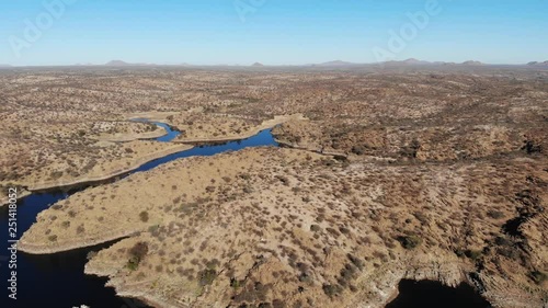 Beautiful Lake Oanob water reserve with dam close to Windhouk, holiday destination in Namibia, Aerial drone shot photo