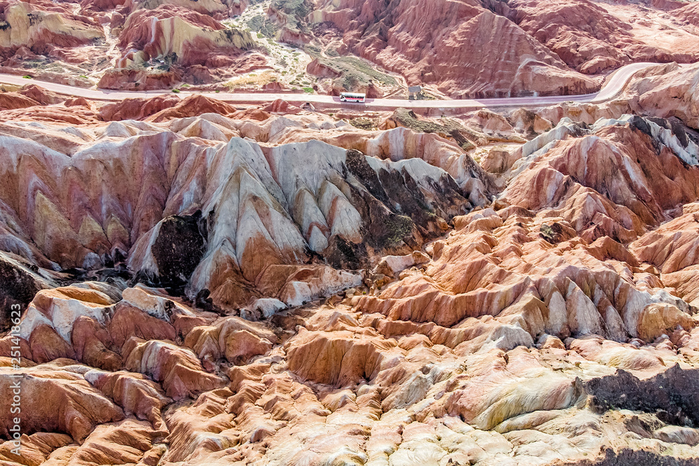 Tourist Buses in Rainbow Mountains Zhangye Danxia Landform Geological Park in China and Road. Tourist Buses in Rainbow Mountains Zhangye Danxia Landform Geological Park in China and Road.