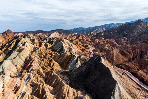 Tourist Buses in Rainbow Mountains Zhangye Danxia Landform Geological Park in China and Road.