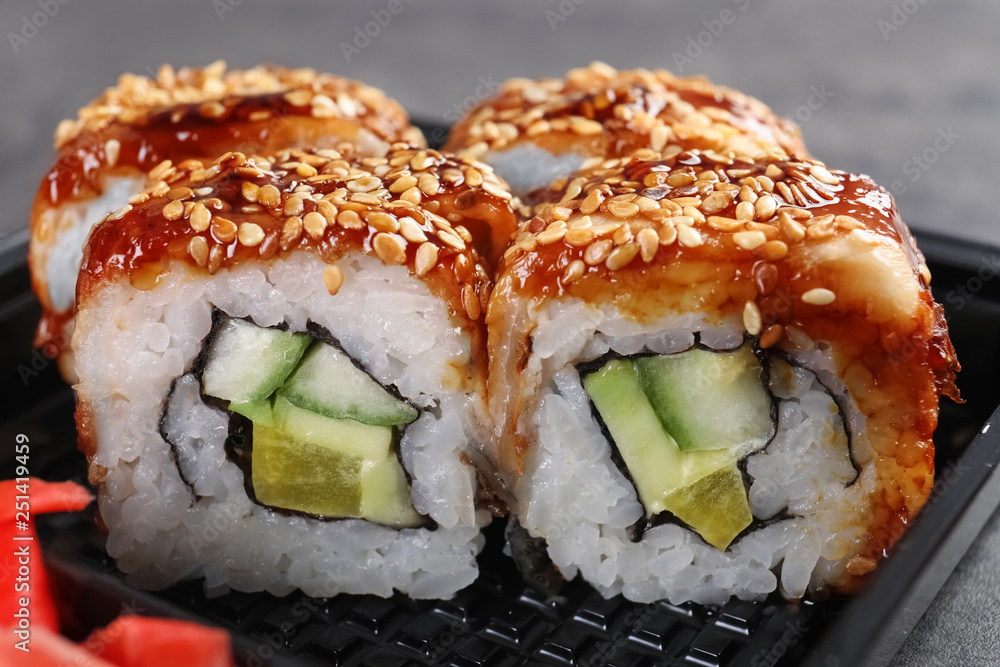 Fresh tasty sushi rolls, closeup. Food delivery service Fresh tasty sushi rolls, closeup. Food delivery service