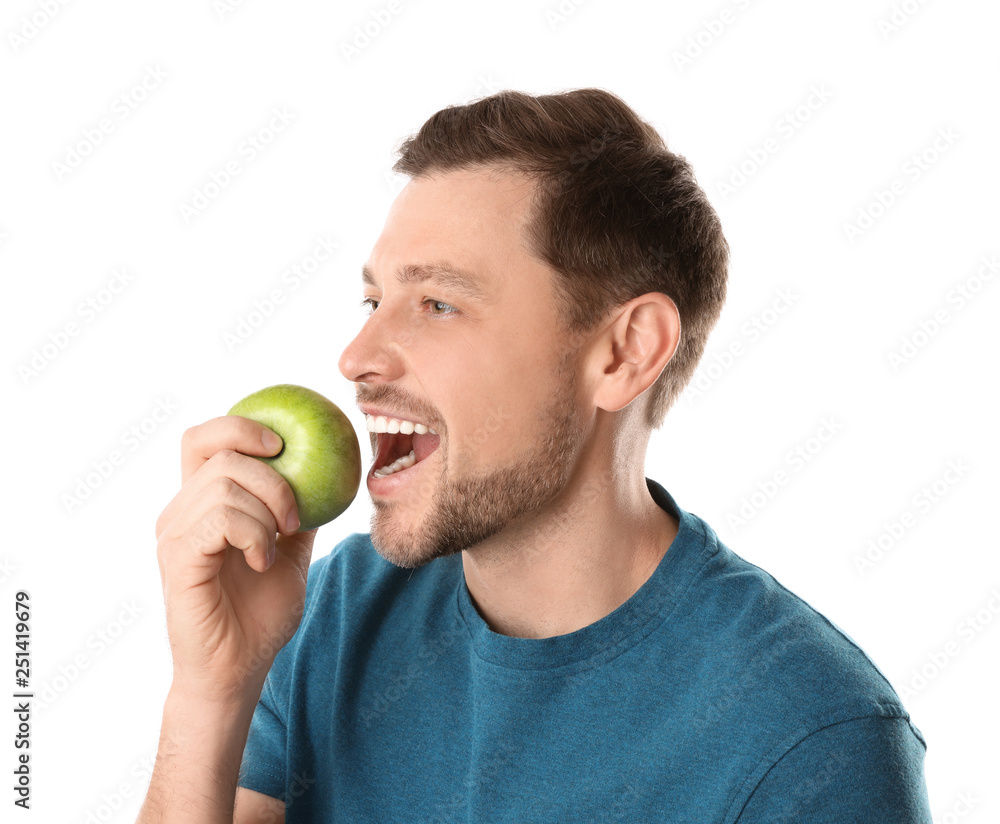 Man with perfect teeth and green apple on white background Man with perfect teeth and green apple on white background