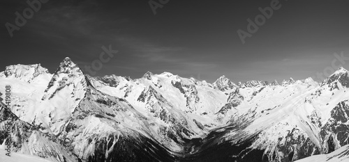 Panorama of snow covered mountain peaks