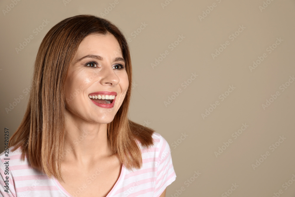 Smiling woman with perfect teeth on color background. Space for text Smiling woman with perfect teeth on color background. Space for text