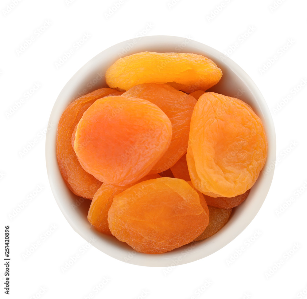 Bowl with apricots on white background, top view. Dried fruit as healthy food Bowl with apricots on white background, top view. Dried fruit as healthy food