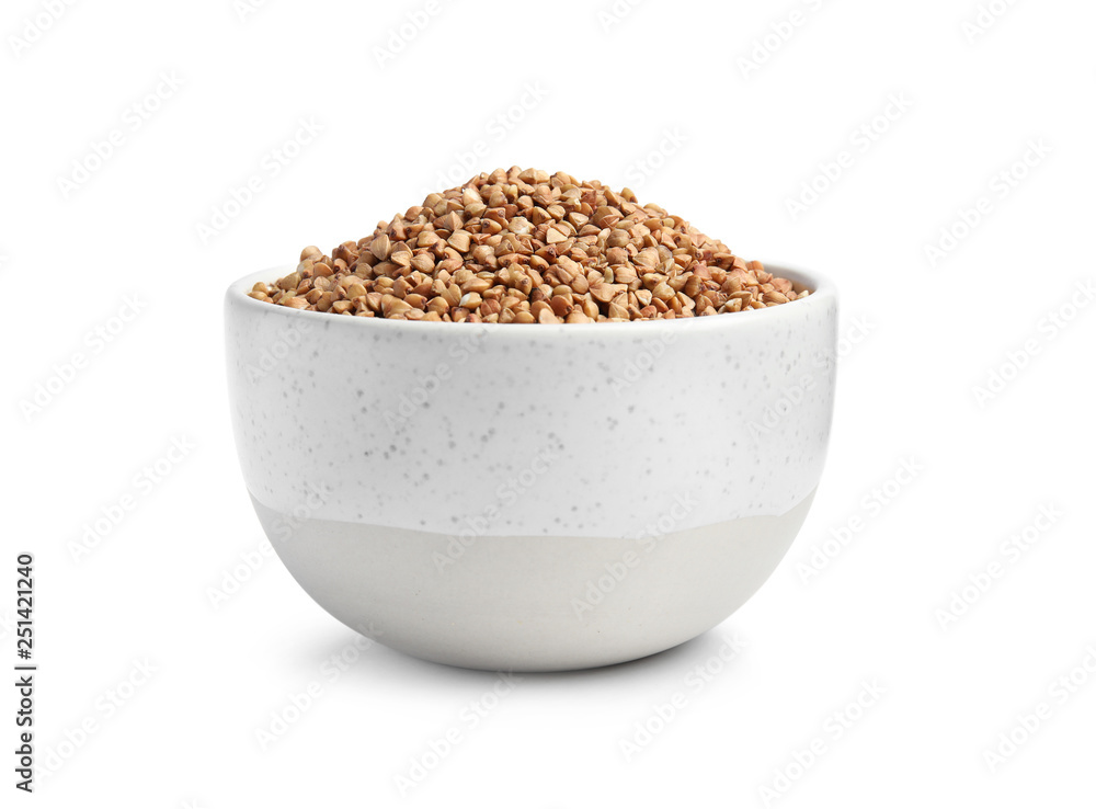 Bowl with uncooked buckwheat on white background Bowl with uncooked buckwheat on white background