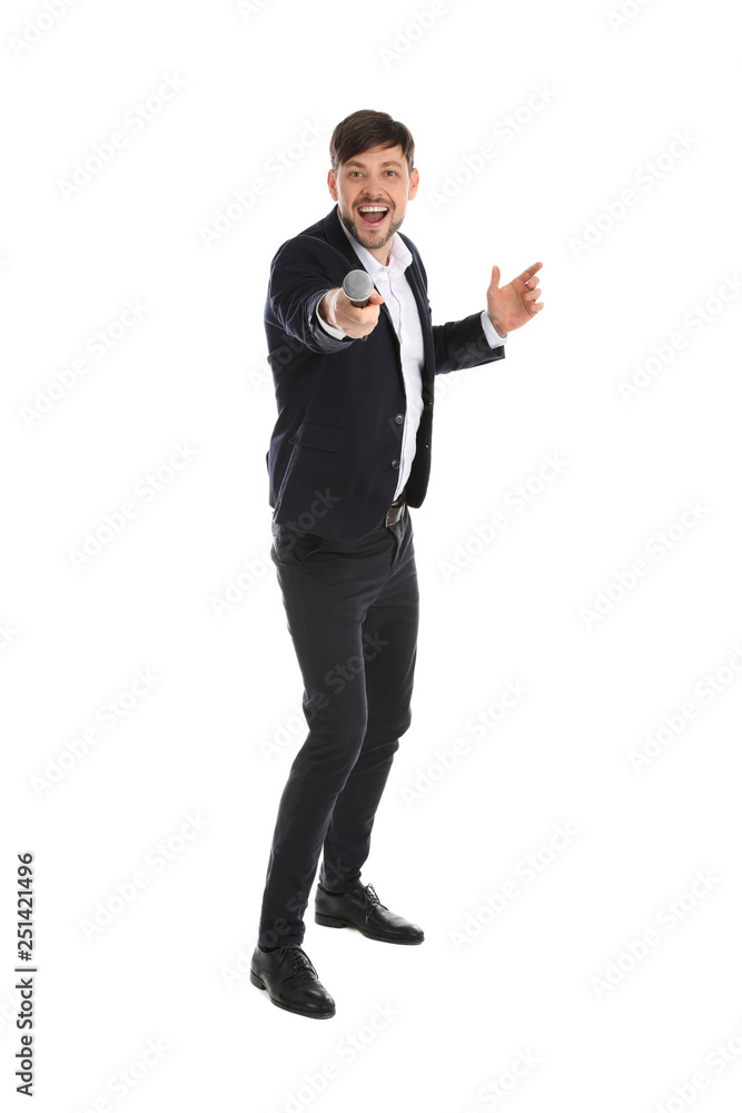 Handsome man in suit singing with microphone on white background Handsome man in suit singing with microphone on white background