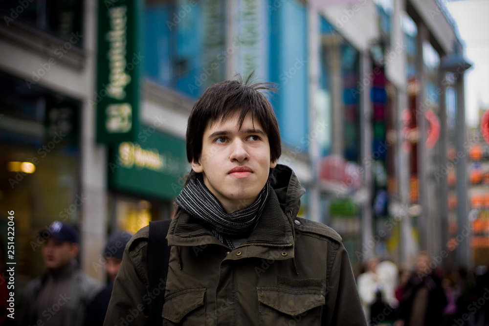 Fototapeta premium Young man tourist in a city street