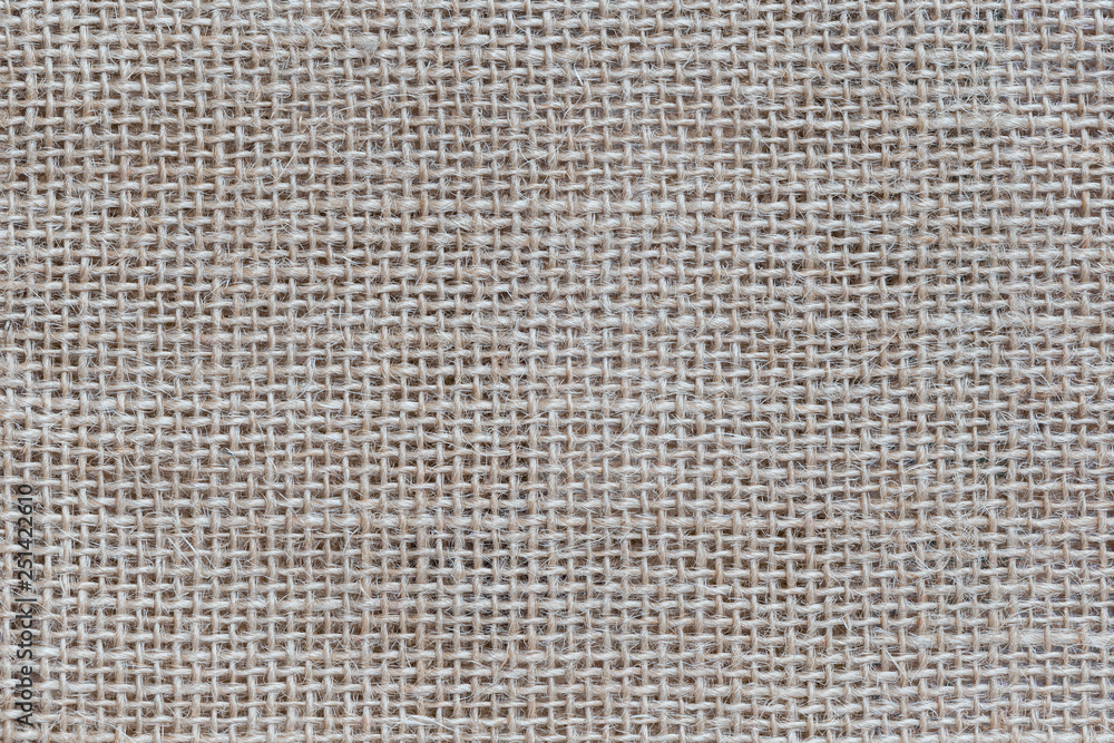 Close-up of a burlap jute canvas full frame background. Close-up of a burlap jute canvas full frame background.