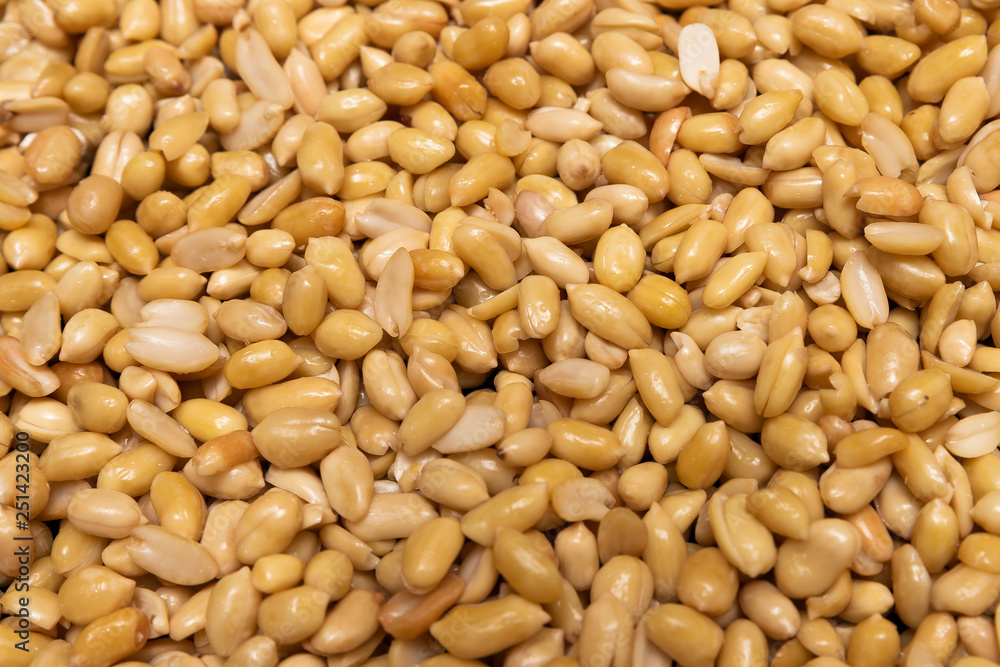 Washed grains of peeled peanuts ready for frying Washed grains of peeled peanuts ready for frying