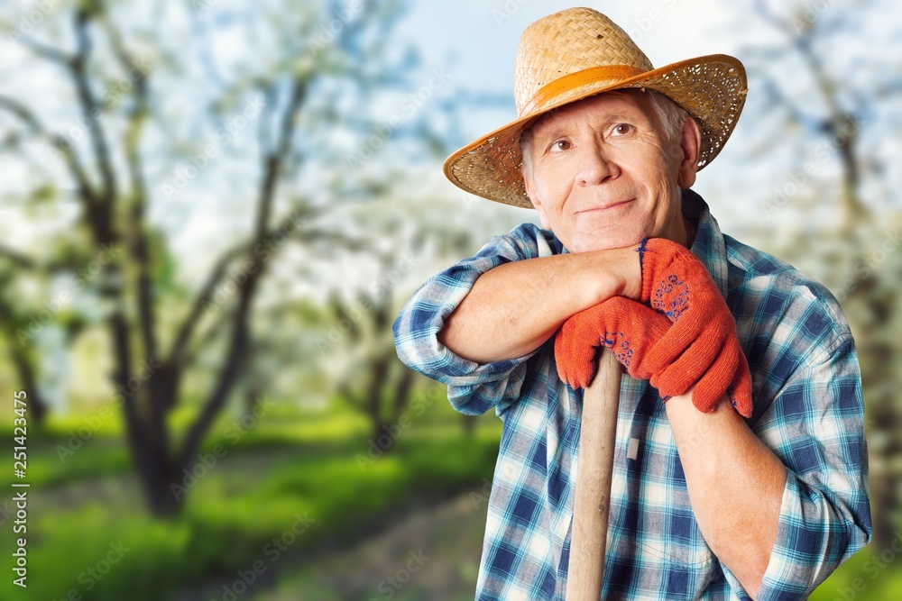Fototapeta premium Thoughtful senior man with glasses outdoors