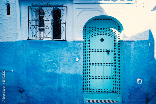 Chefchaouen - blue city of Morocco. Detail on a blue doors and walls. Blue town street. © tibor13