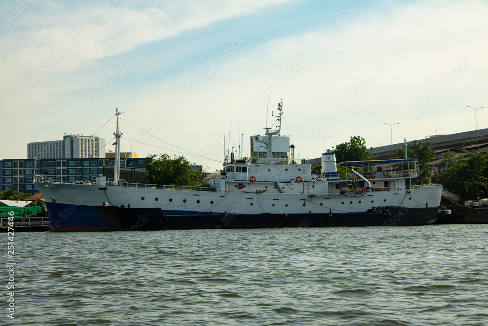 Bangkok river with ships in port, transpotration and cargo concept. Thailand vessel