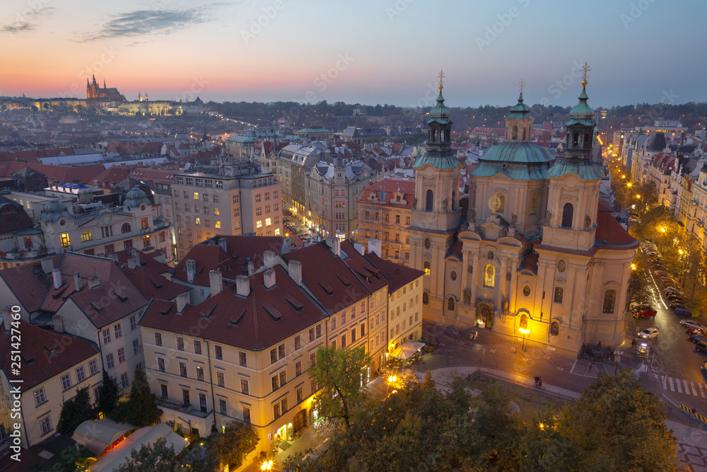 Prague - The panorama with the St. Nicholas church,   Staromestske square and the Old Town at dusk..