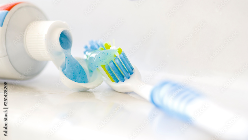 Pale blue toothbrush and toothpaste Pale blue toothbrush and toothpaste