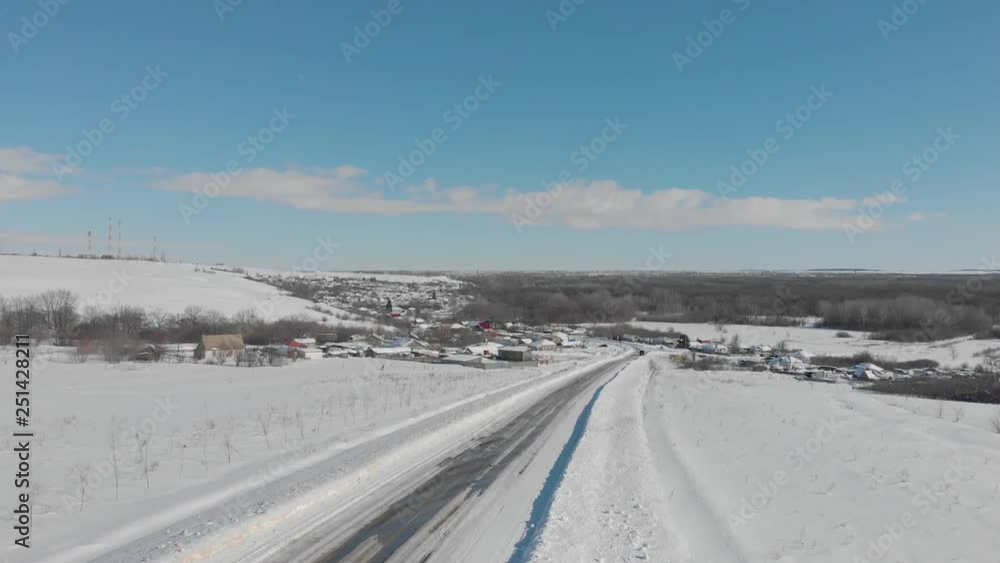 Aerial view of small village and roads in winter, winter landscape. Aerial view of small village and roads in winter, winter landscape.