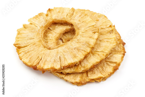 Dried pineapple rings, close-up, isolated on white background
